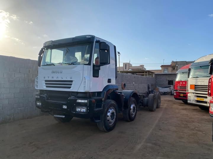 Orange Iveco truck in yard
